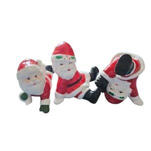 3 vintage ceramic tumbling Santa's figurines decor